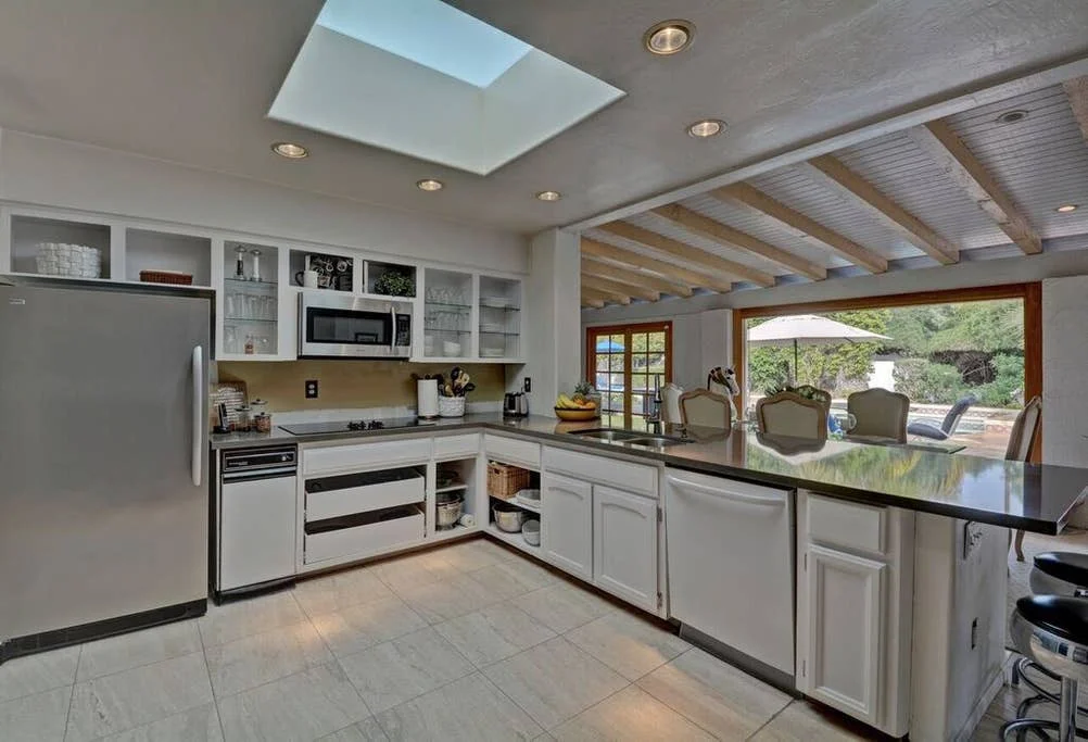 A large, recently renovated, fully equipped kitchen with breakfast bar awaits your dining pleasure.