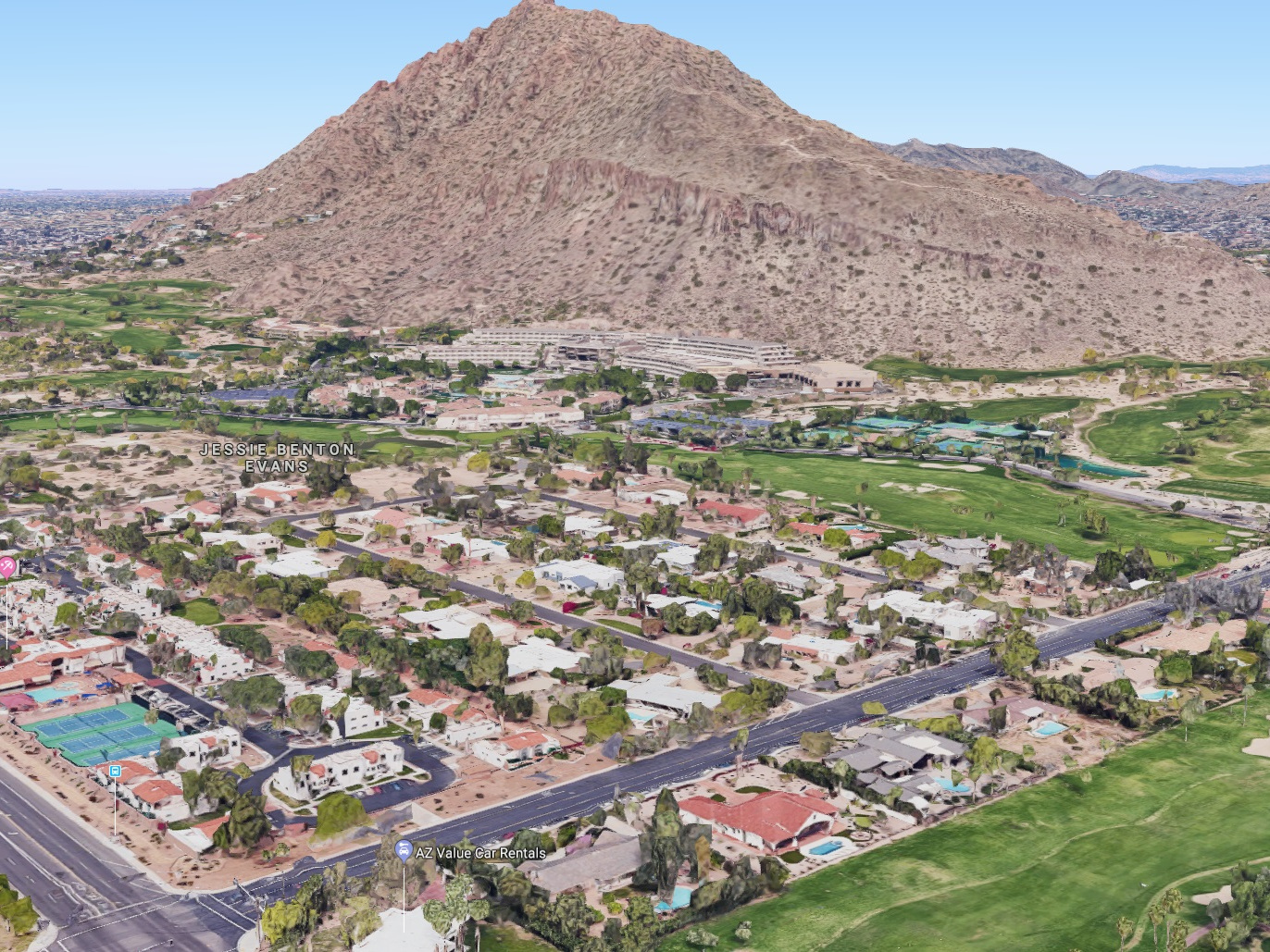 The red bushes in the center of the image mark our location. Picture is facing Northwest with The Phoenician and Camelback Mountain in the background.Lower-left intersection is E Camelback Road (heading down —> east) and N 64th Street (head right…
