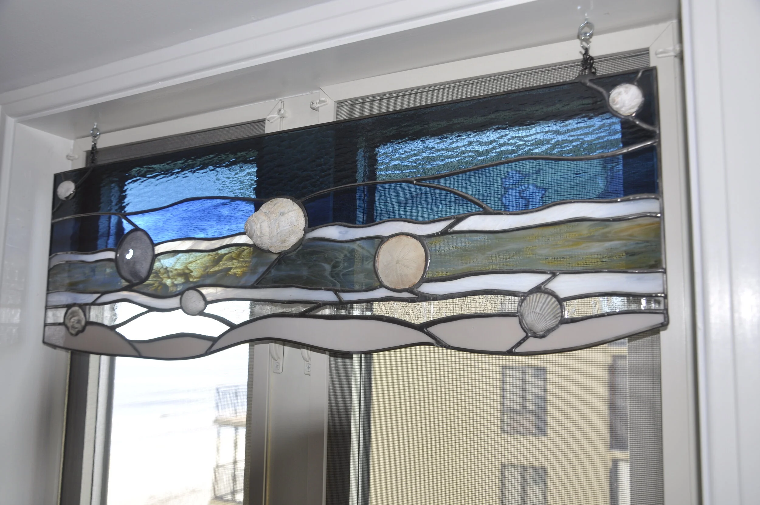  The is a piece I made for my newly renovated kitchen instead of a boring window shade.   Original design of the beach - from sand to sea - with embedded shells found out there.    Custom pieces could be made. This piece measures ~31” wide x 10.5” hi