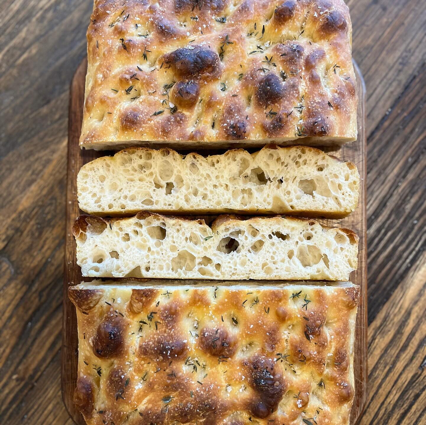 Sourdough focaccia, yum. Fresh thyme and sea salt, 80% H2O, 75/25 bread/plain flour, ~20% starter (well past it&rsquo;s prime given the heat the day before). 8 hour bulk at about 23-24C. Organic flour from @wholegrain_milling really soaks up the wate