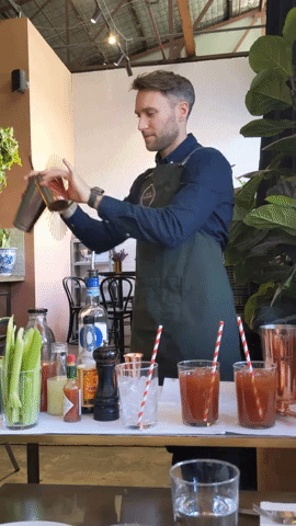 Our bartender serving cocktails table-side!