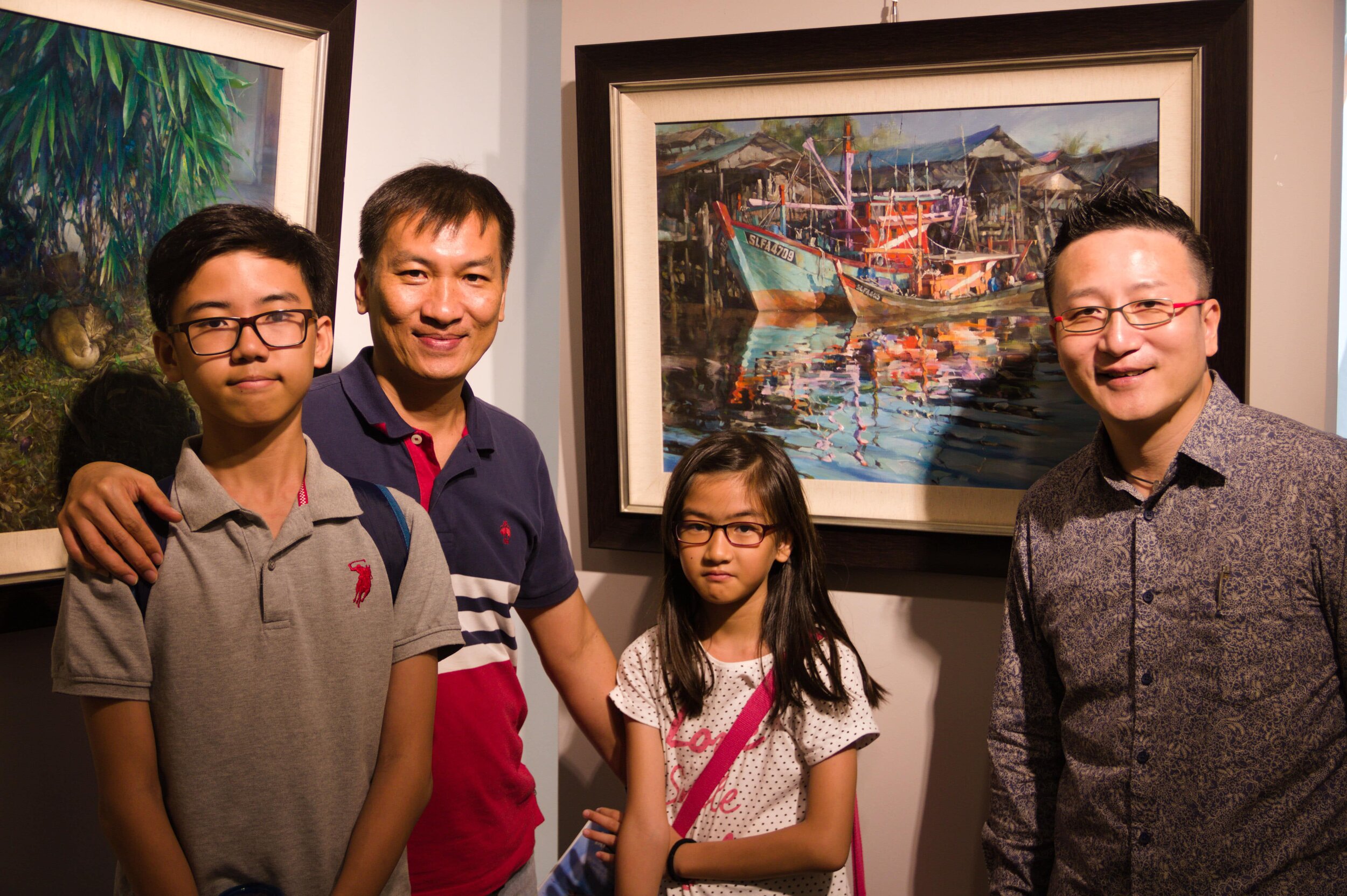 Wang Fei with a collector and his family 