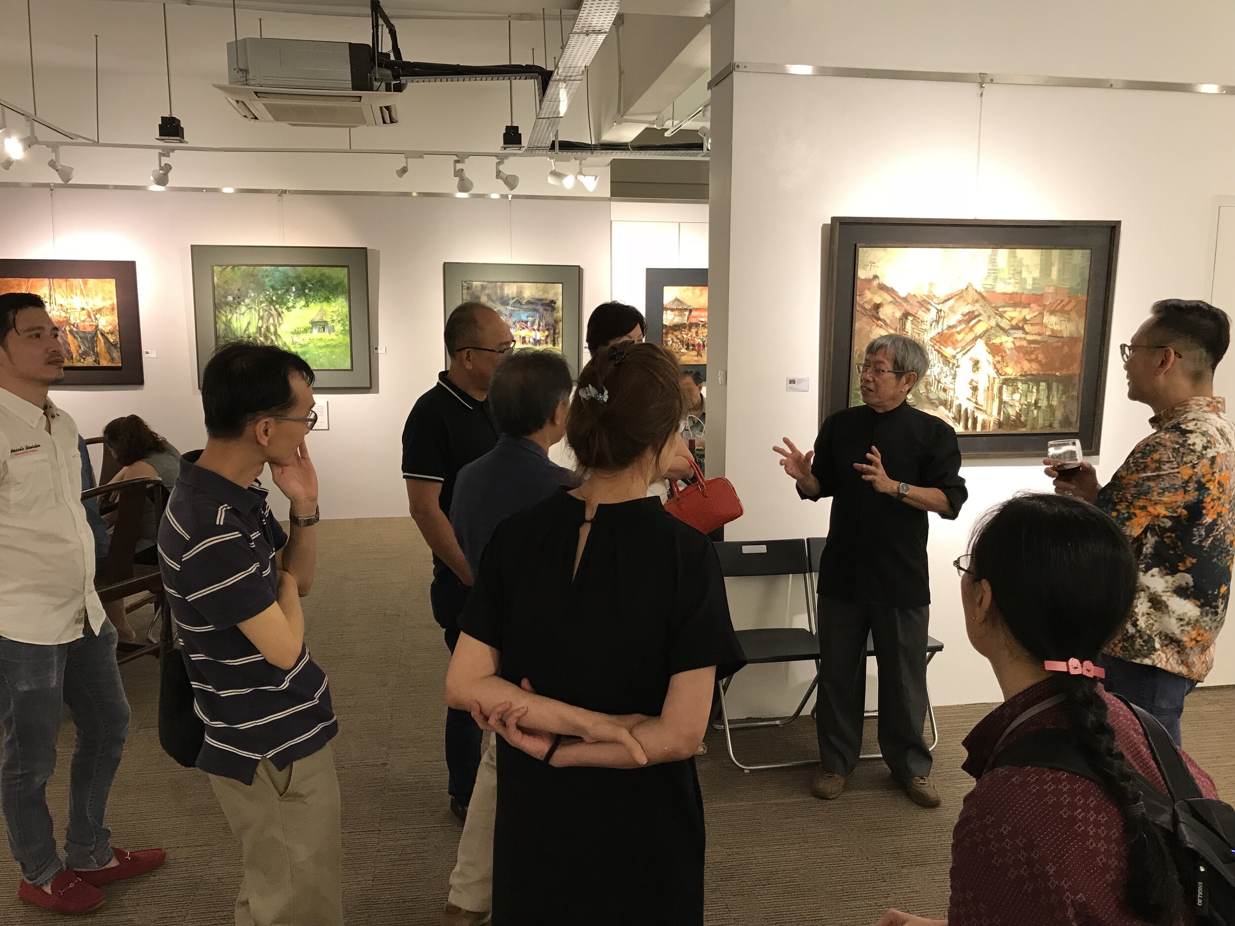  Mr Eng Siak Loy having a short tour during his solo exhibition in 2018  