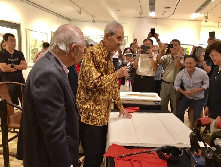  Mr Lim Tze Peng preparing to demonstrate his calligraphy writing during his solo exhibition in 2019 