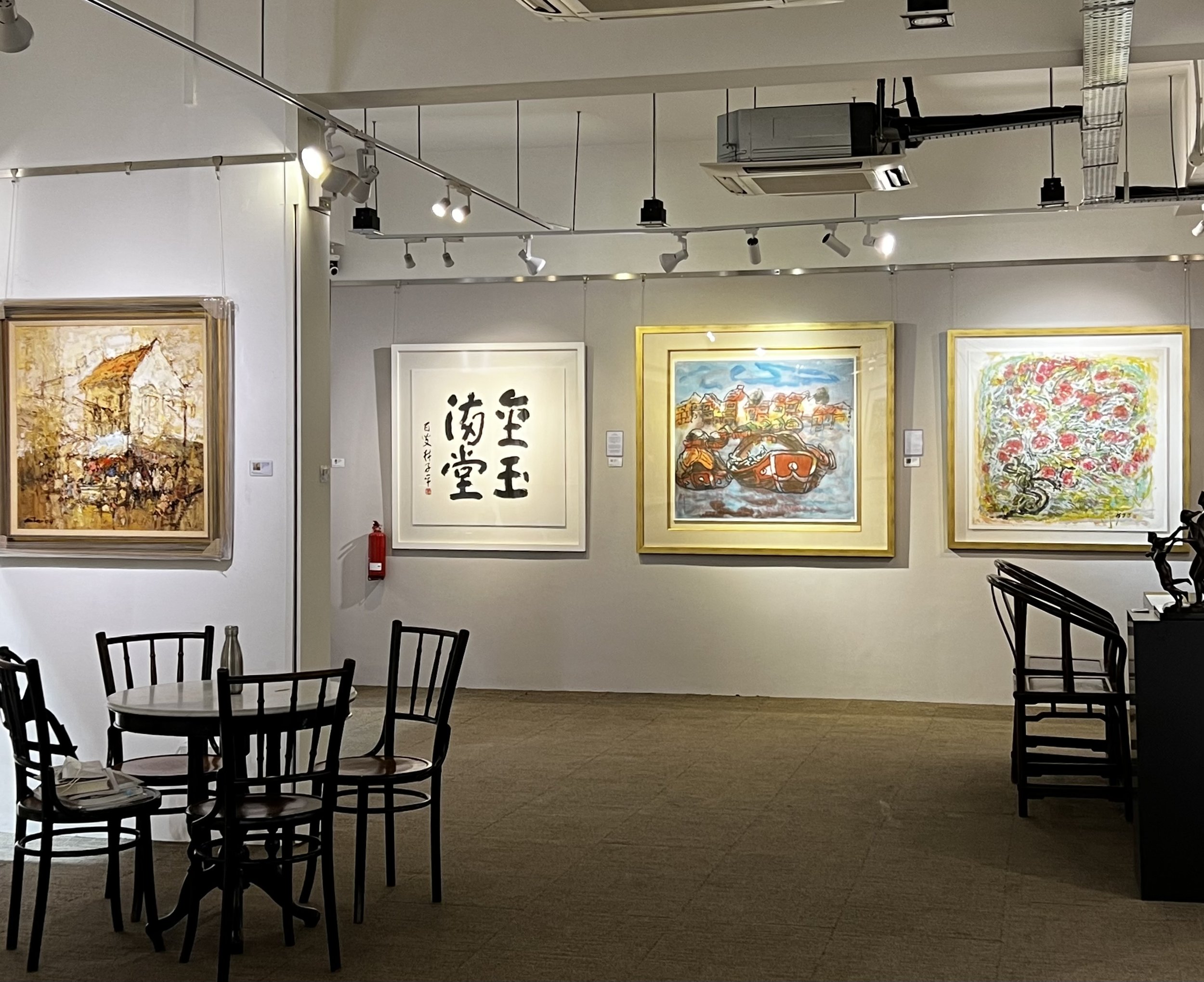 Paintings by Ang Ah Tee (left) and Lim Tze Peng (right)