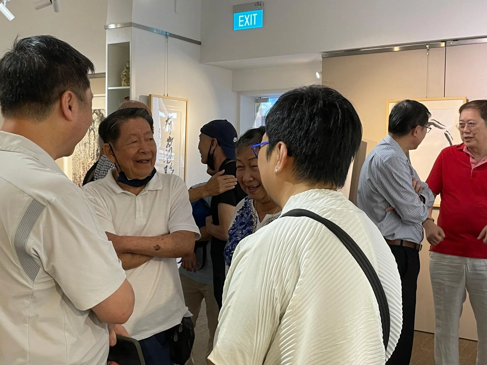 Tan Oe Pang talking to visitors