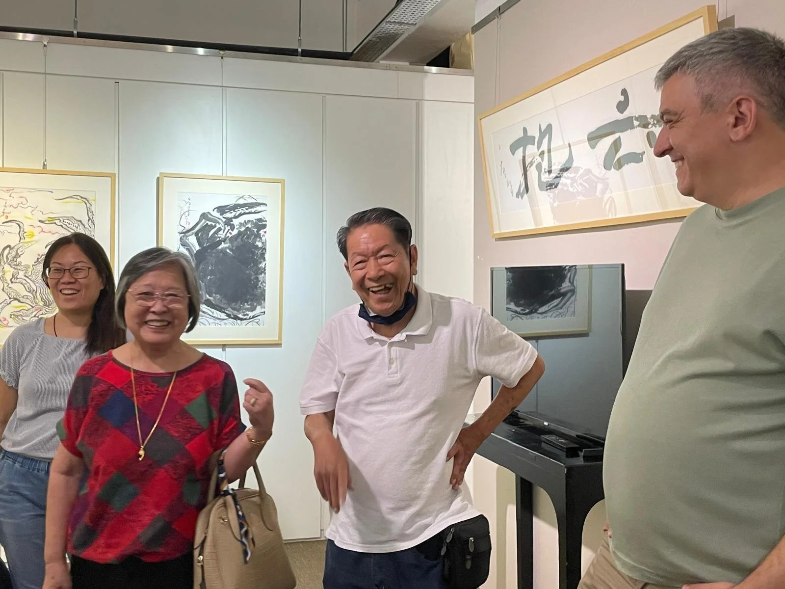 Tan Oe Pang talking to visitors