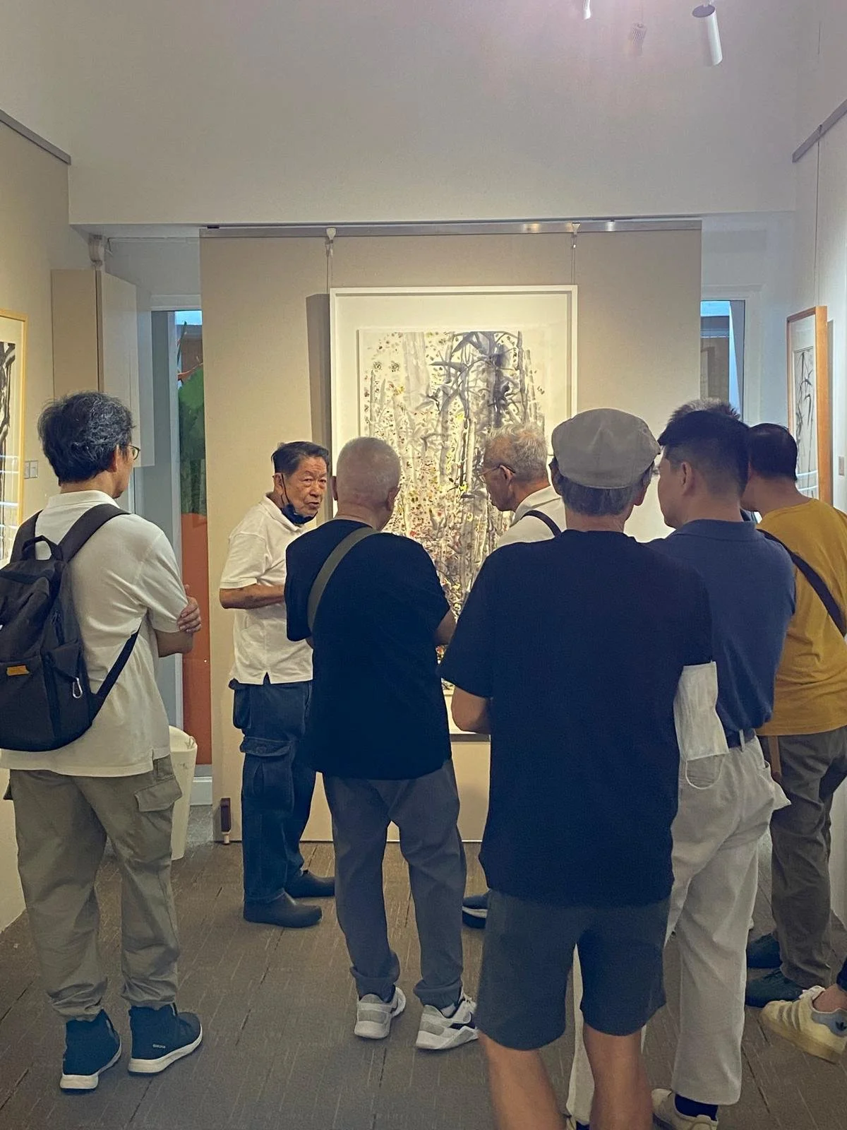 Tan Oe Pang talking to visitors