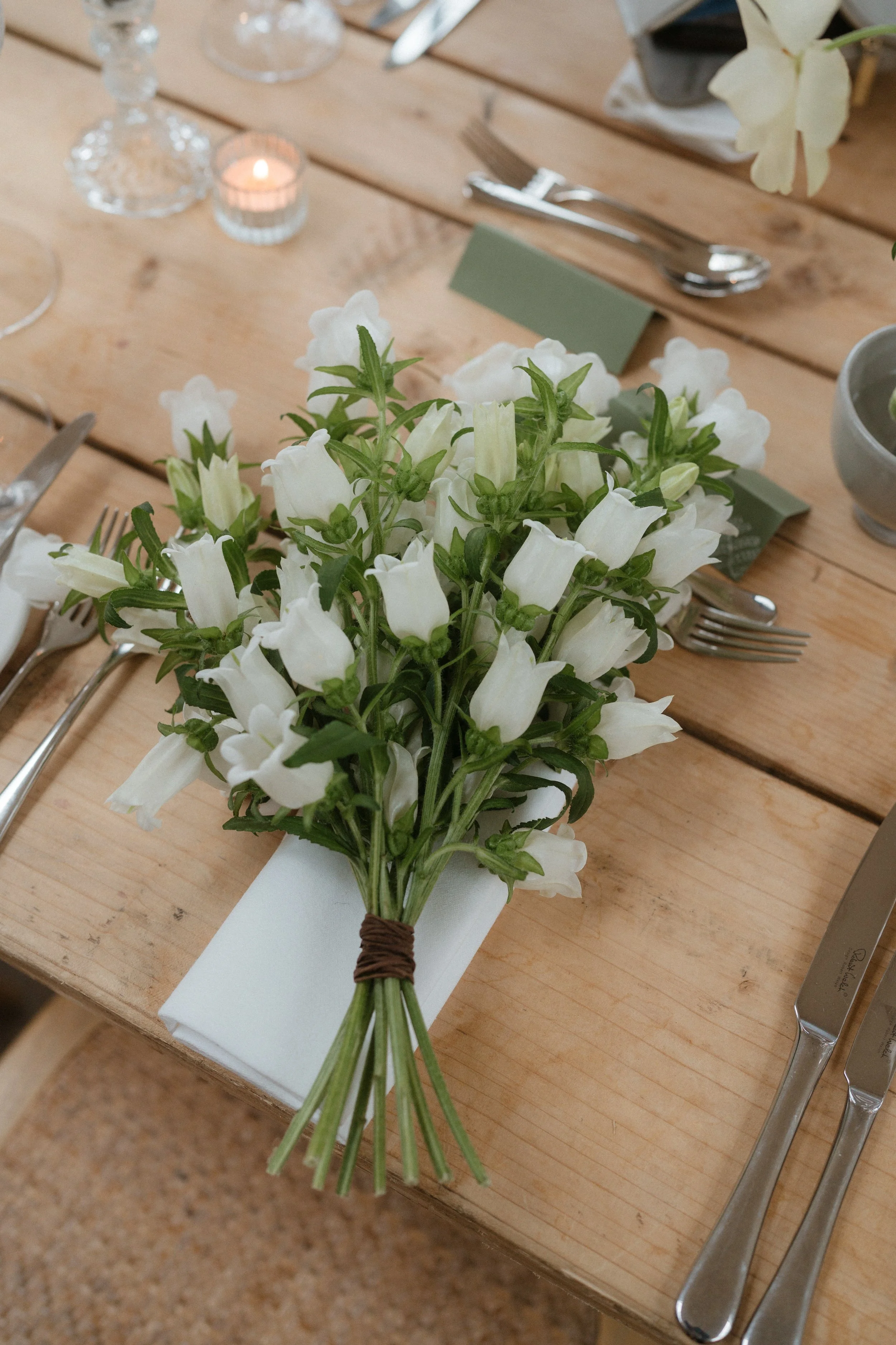 Hand tied bridesmaid bouquet created by honour farm flowers for wedding at The Fig House, Middleton Lodge.