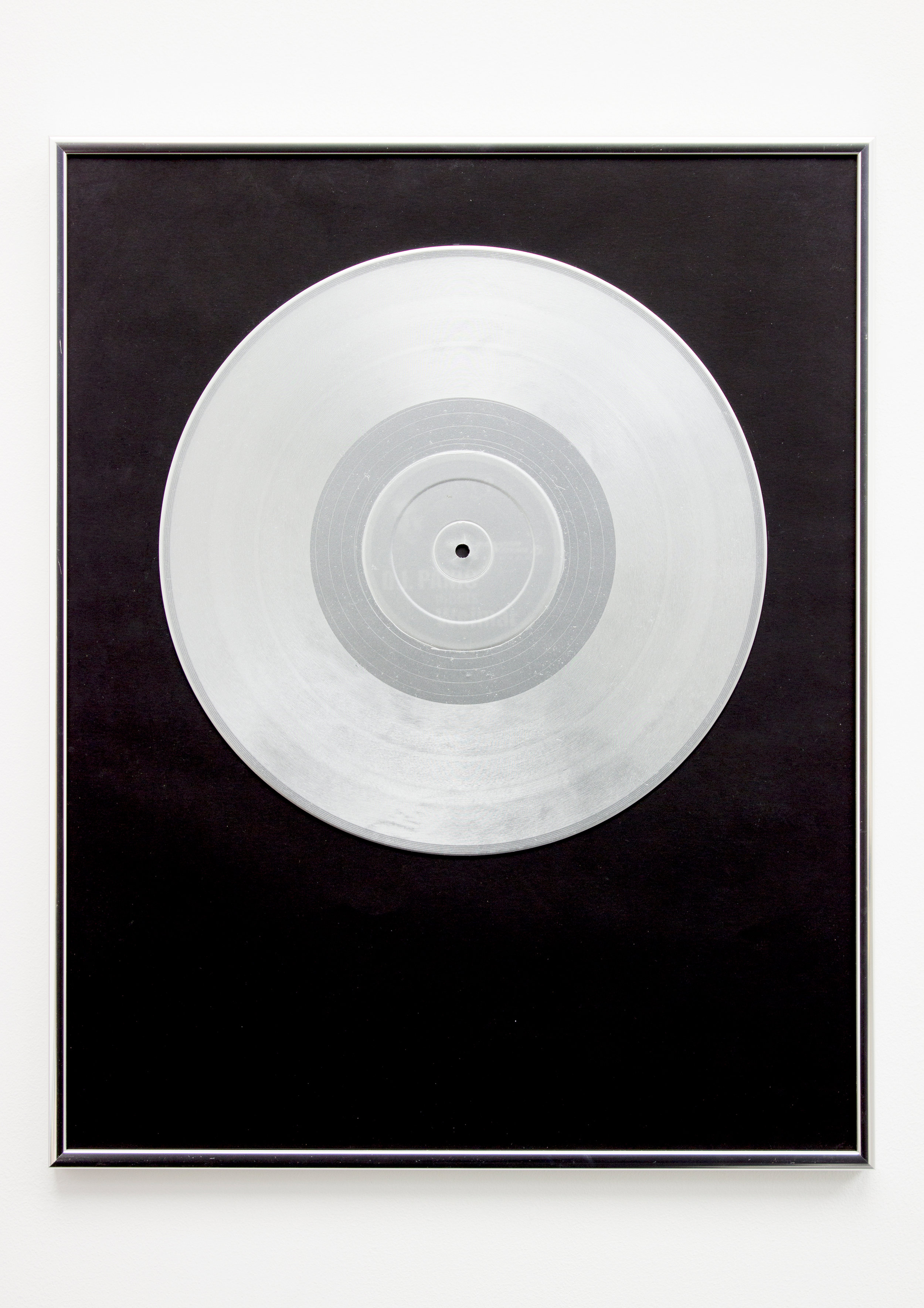  12"15. Vinyl record, spray paint, paper &amp; silver frame, 51cm x 41cm x 2cm, 2019. ©Neil Kilby 2019. 