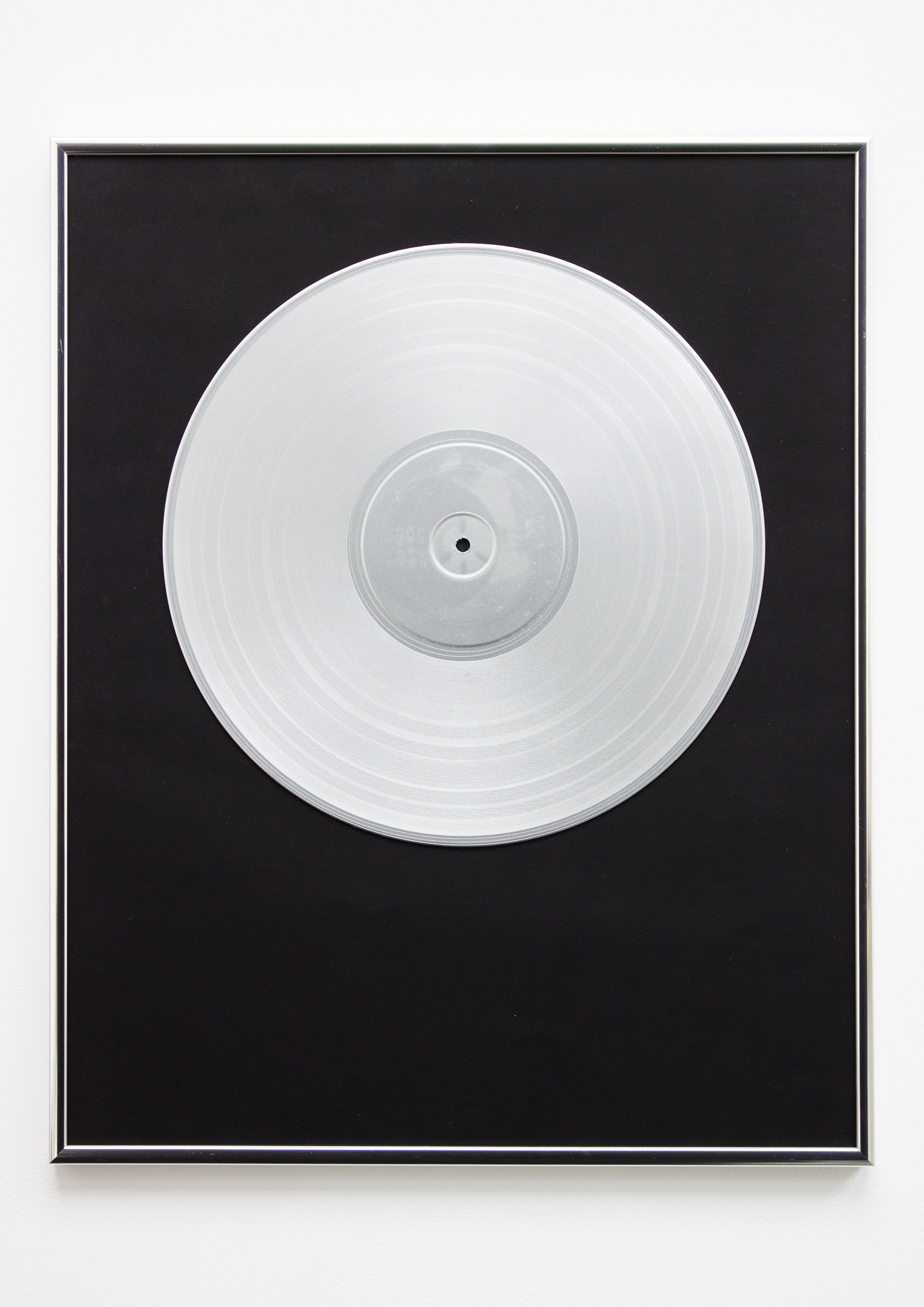  12"14. Vinyl record, spray paint, paper &amp; silver frame, 51cm x 41cm x 2cm, 2019. ©Neil Kilby. 