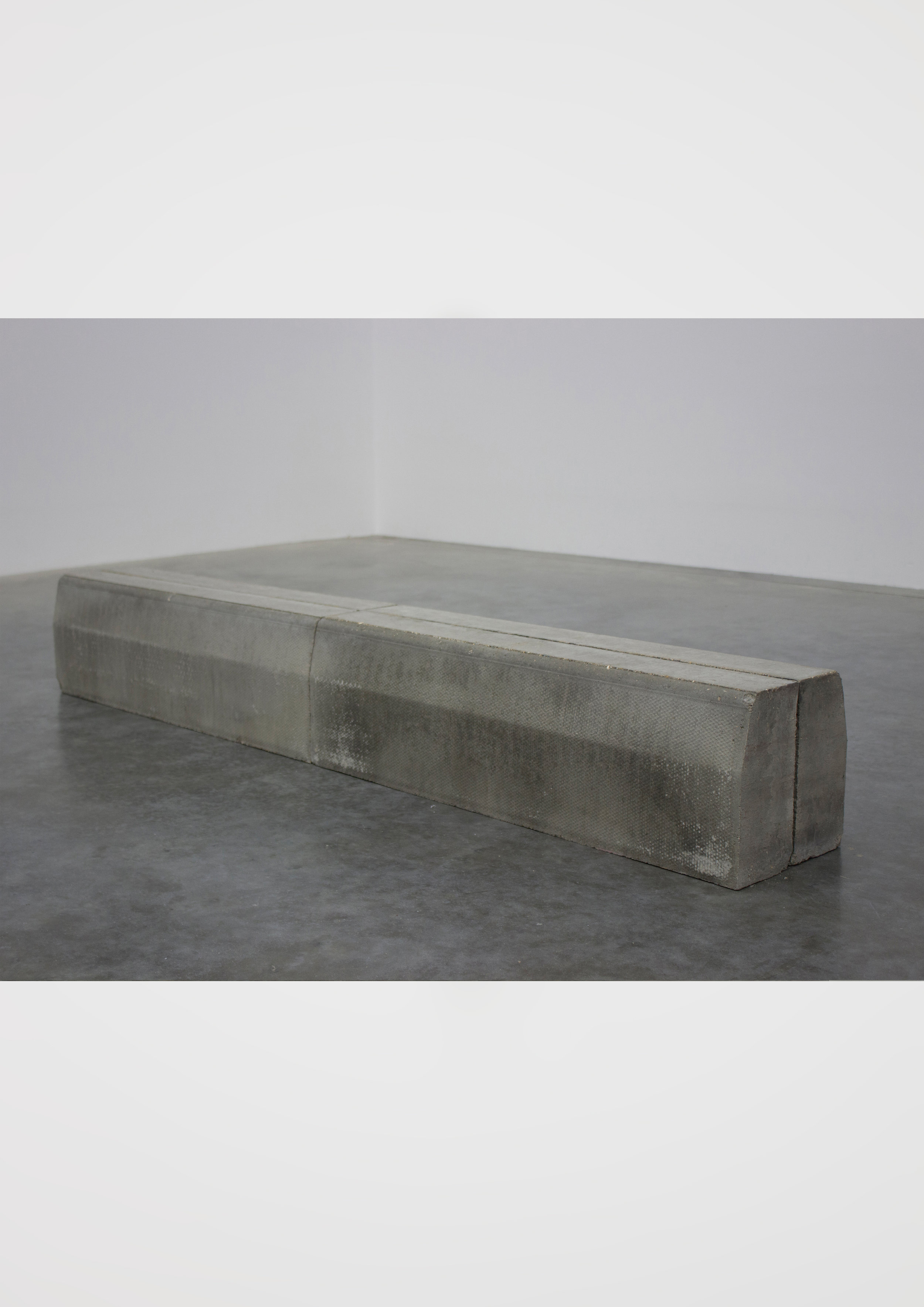  Lip Slide 1. 4 concrete kerbstones, 25.5cm x 25cm x 183cm, 2017. ©Neil Kilby 2019. 