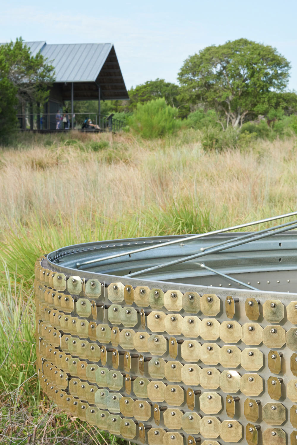  The golden sequins reflect light and simulate the effects of seeing fire far off in the distance.  