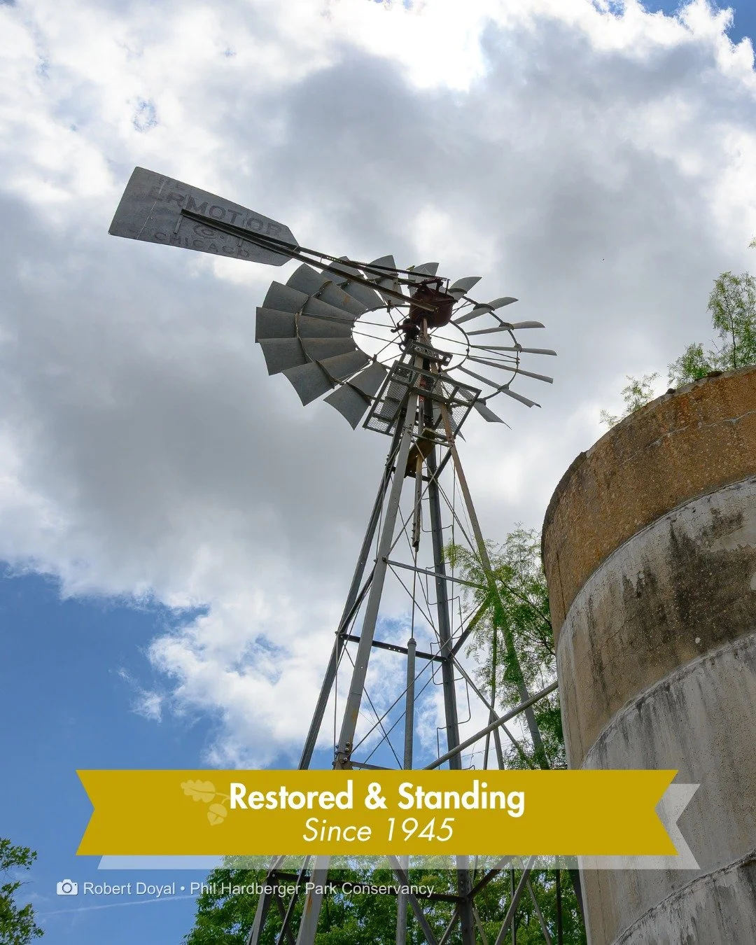 That label on the tail is a giveaway.

This is an Aermotor windmill, one of the most popular farm windmill makers in the country. It's been restored and has been part of the Voelcker Historic Homestead since around 1945, right next to the concrete ci