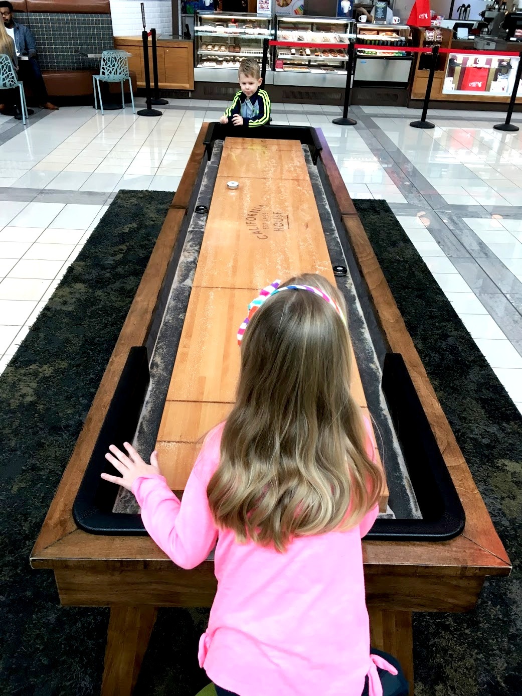 Playing shuffleboard at Stonebriar Centre Frisco