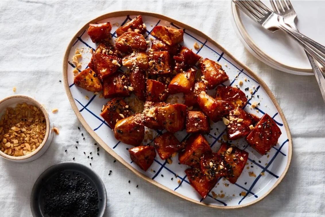 Food 52: Goguma Mattang (Candied Sweet Potatoes). PHOTO BY JAMES RANSOM. PROP STYLIST: BROOKE DEONARINE. FOOD STYLIST: SAMANTHA SENEVIRATNE.