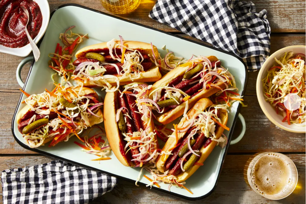 FOOD52: SPLIT BBQ HOT DOGS WITH CRUNCHY-TANGY SLAW. PHOTO: TY MECHAM. PROP STYLIST: MEGAN HEDGPETH. FOOD STYLIST: DREW AICHELE.