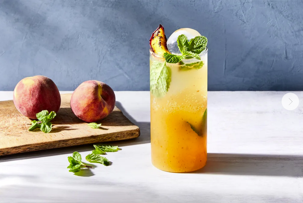 FOOD52: SMOKY-SWEET PEACH SPRITZER. PHOTO: JULIA GARTLAND. PROP STYLIST: SOPHIA PAPPAS. FOOD STYLIST: MONICA PIERINI.