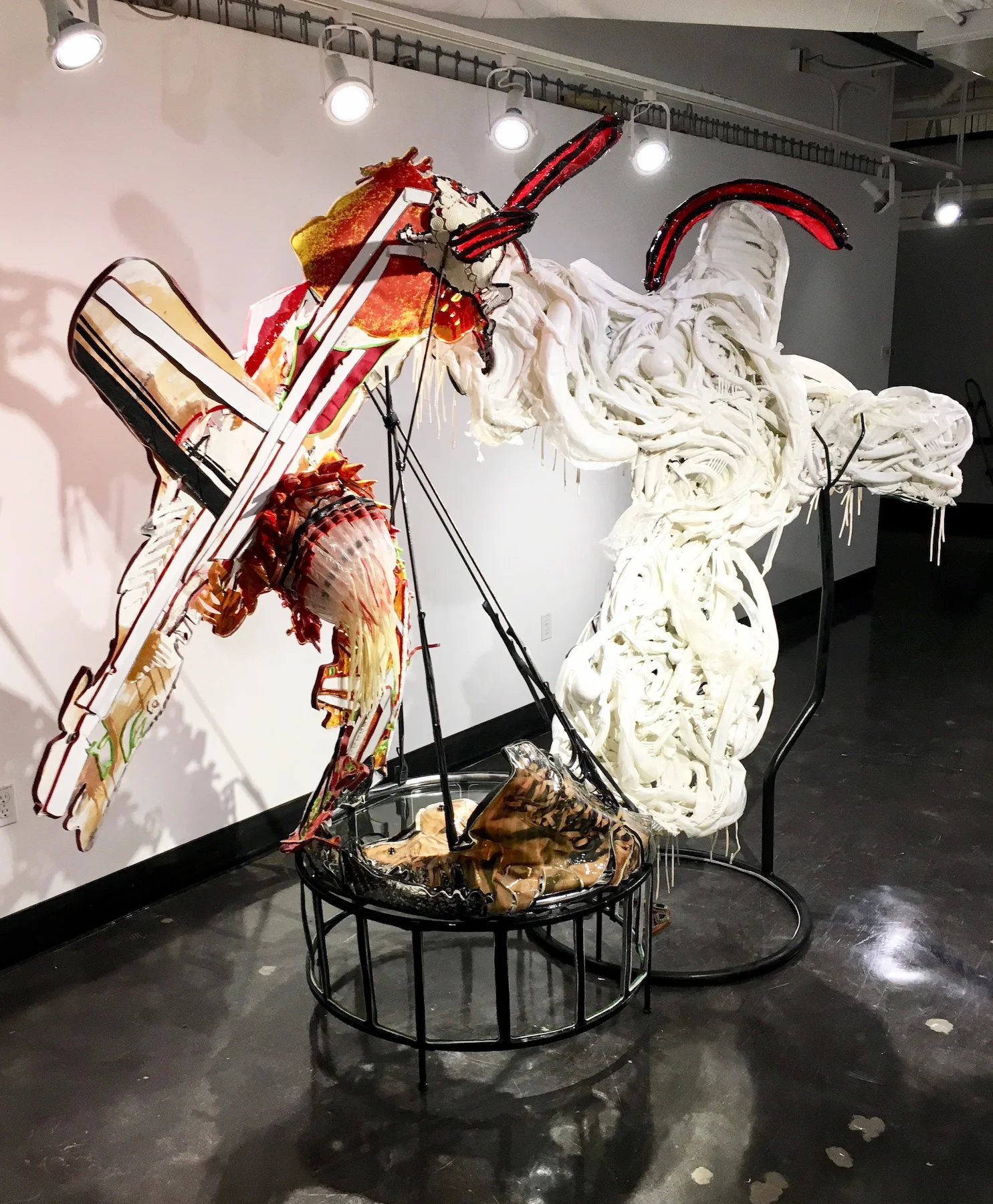 Monumental Loss 2018 Mixed Media: (Vinyl, latex balloons, leather, photos on paper, enamel, welded steel, fabric, plastic straws, glass, broken pipe) 84h x 111w x 35d inches