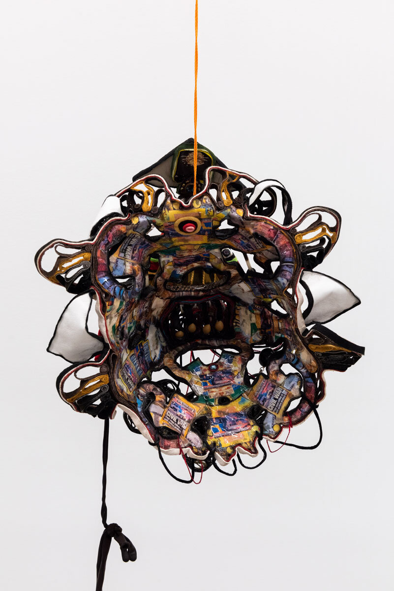  Alicia Piller  Spirit of the Present.  2019 Latex balloons, resin, digital prints on recycled paper, gel medium, leather, porcupine quills, plastic, beads, metal, and string 11 1/2h x 10 1/2w x 7 1/2d in 