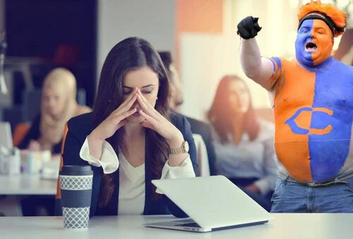 Brilliant! This man is pretending to be a sports fan so he has an excuse to be an asshole at work!