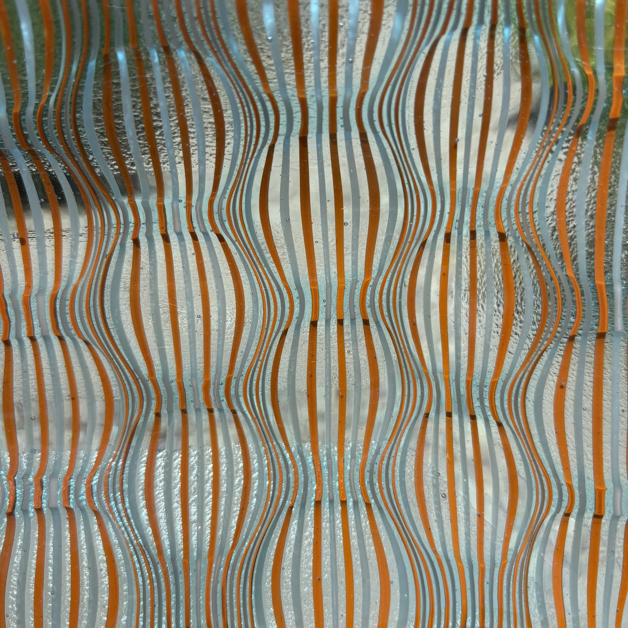 Aqua blue tint base with burnt orange, clear and white stringers close.jpeg