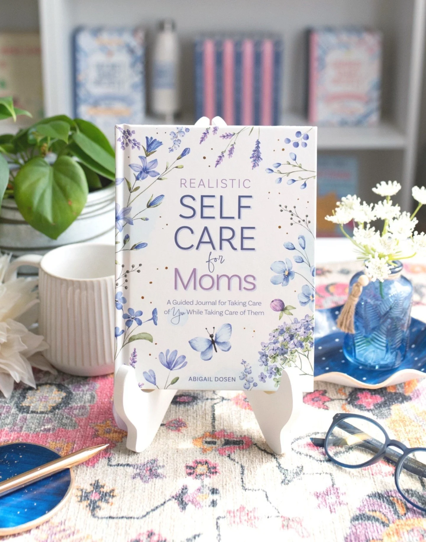 Mother's Day is just around the corner! 🌸 Get the special Mom in your life something to show her how much you care. For any last-minute shoppers, don't just celebrate her this weekend! Realistic Self-Care for Moms by @adosenbooks will nourish her so