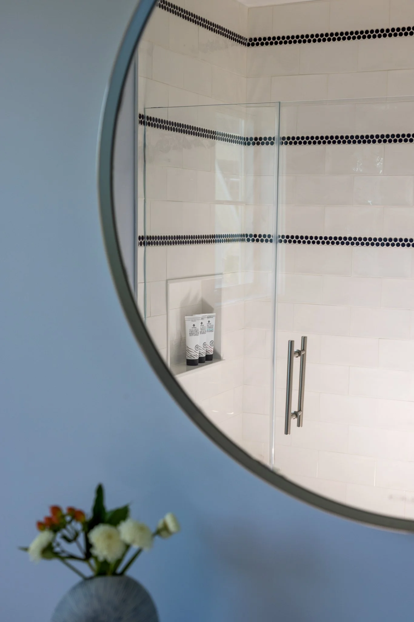 3-design 2 order julie h sheridan interior design coastal canvas guest bathroom tile pattern in shower seen through mirror.jpg
