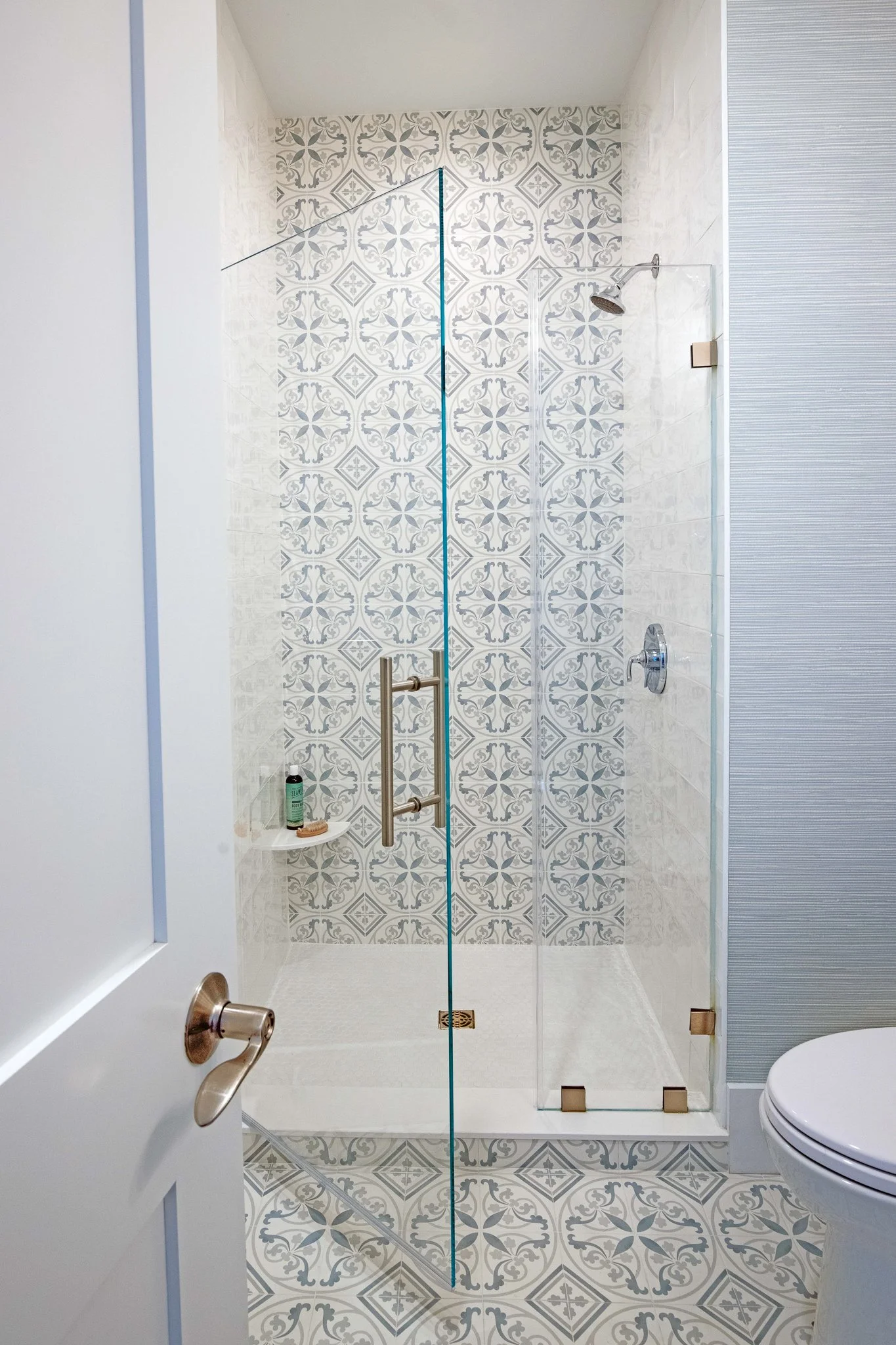 2-design 2 order julie h sheridan interior design coastal canvas guest bathroom vashower and tile patterns.jpg