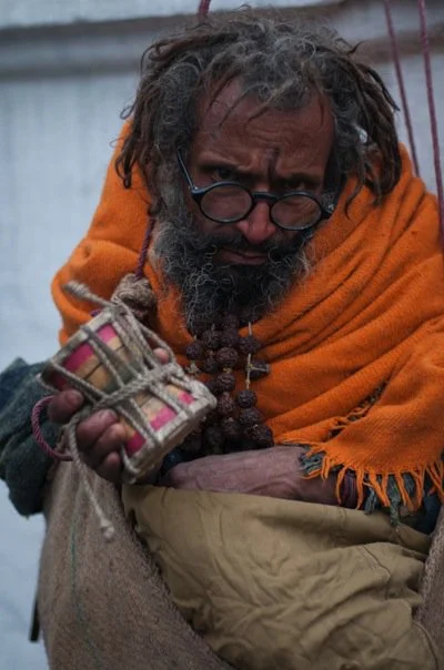 Hanging Baba: This Sadhu was strung up, hanging from ropes tied to a pillar behind him.