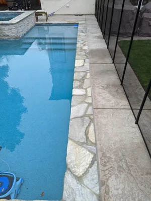 Completed concrete, pool deck and backyard construction project