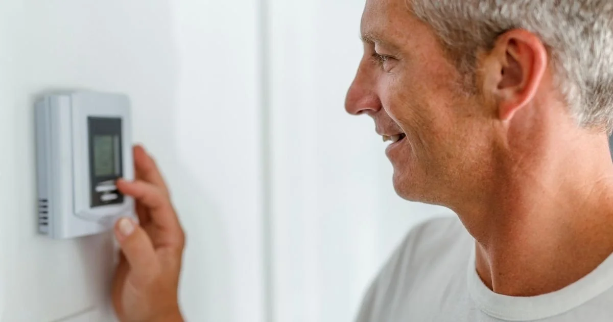 What is the energy-saving mode on the thermostat? Does it work to save money?