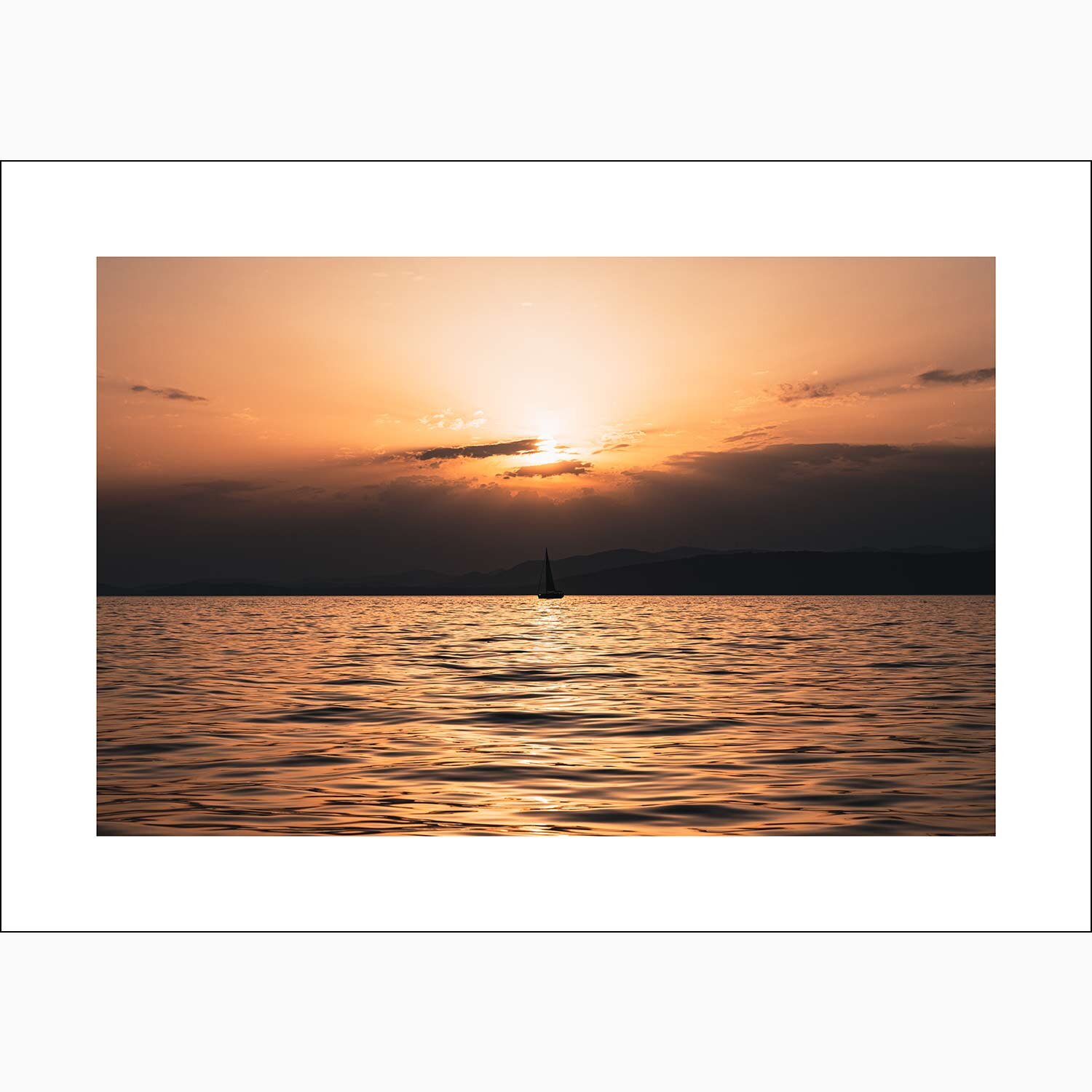 Boat sails into orange sky setting sun of coast of Split Croatia print
