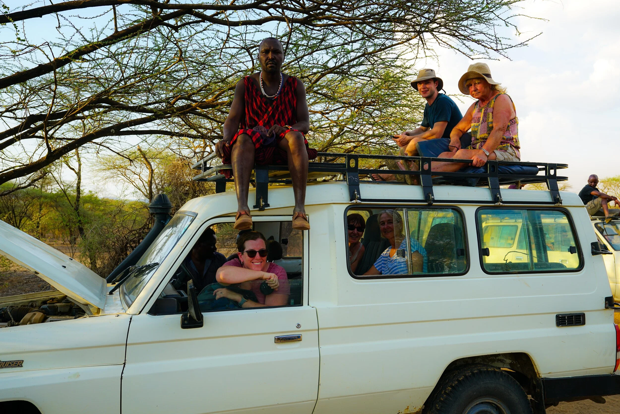  We’re being taken on a game drive, in search of those 50 lions and etc.  