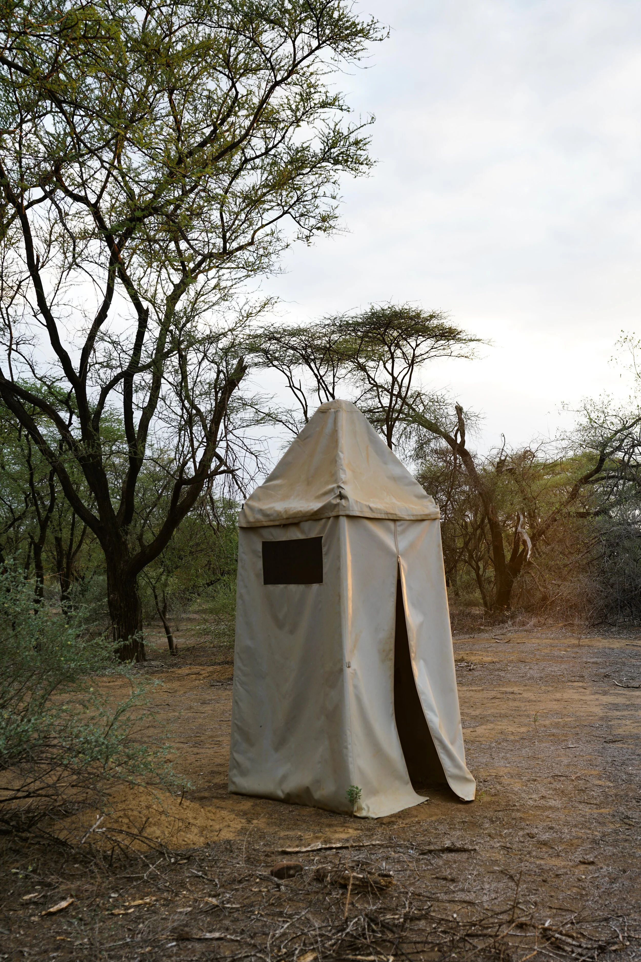  Outhouse.  Do not be afraid.  Try to keep it closed to protect your privacy.  Do not close it too much or you will die of stench and flies.  There are baboons and leopard watching you.  Don’t stress.  