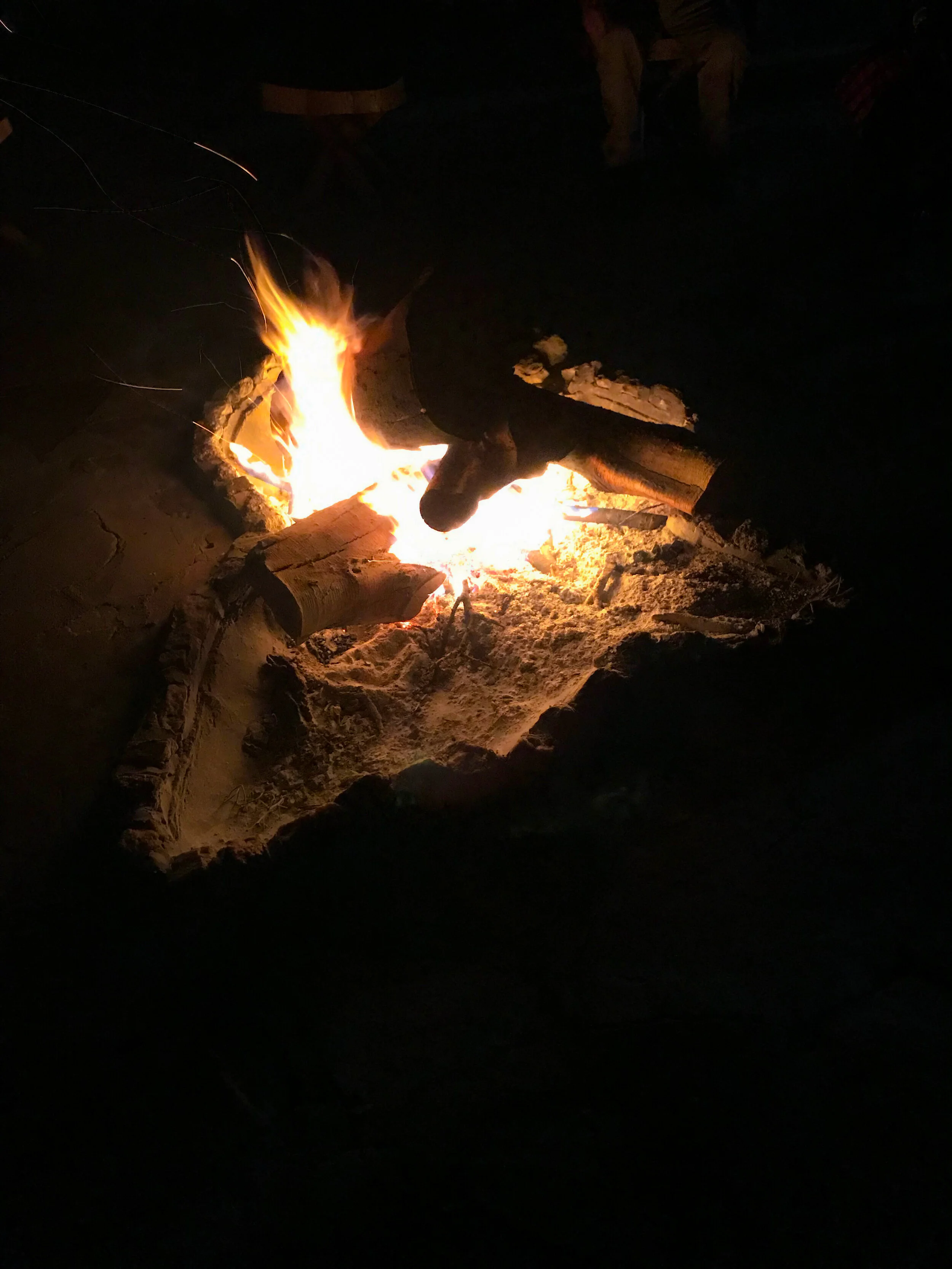  Dinner and then this Africa campfire, under the stars with the moaning chanting of the Masai song.    We’re hosted by a local chief.  He’s very friendly.  By nightfall he seems drunk.  He offers a local ceremonial brew.  We’re honoured.  I dump the 