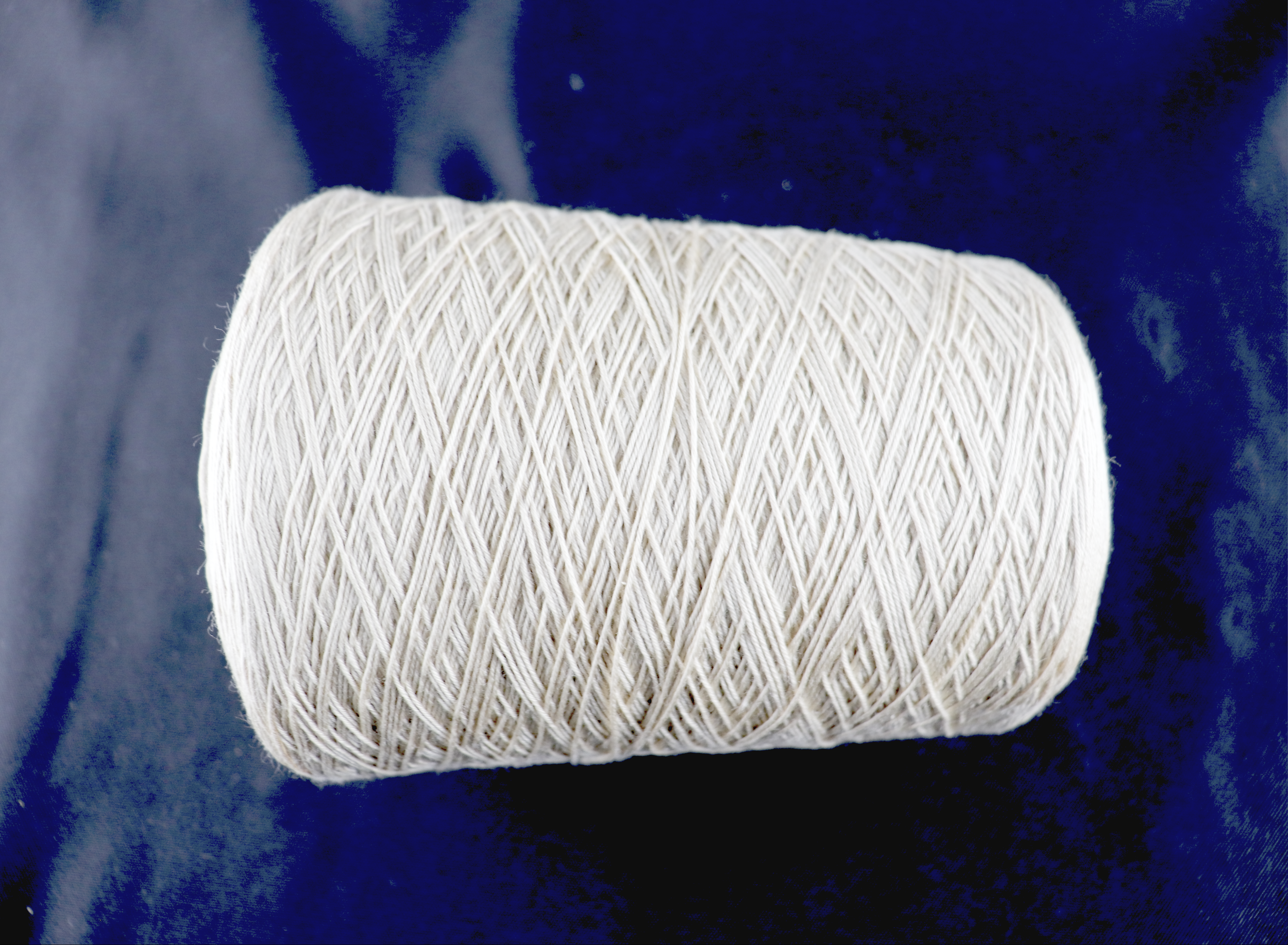 Thick 100% SeaCell yarn. 24/6nm (12/3nm equivalent), fingering weight yarn ~1985 yards per pound. $59/lb on ~1kg cones.