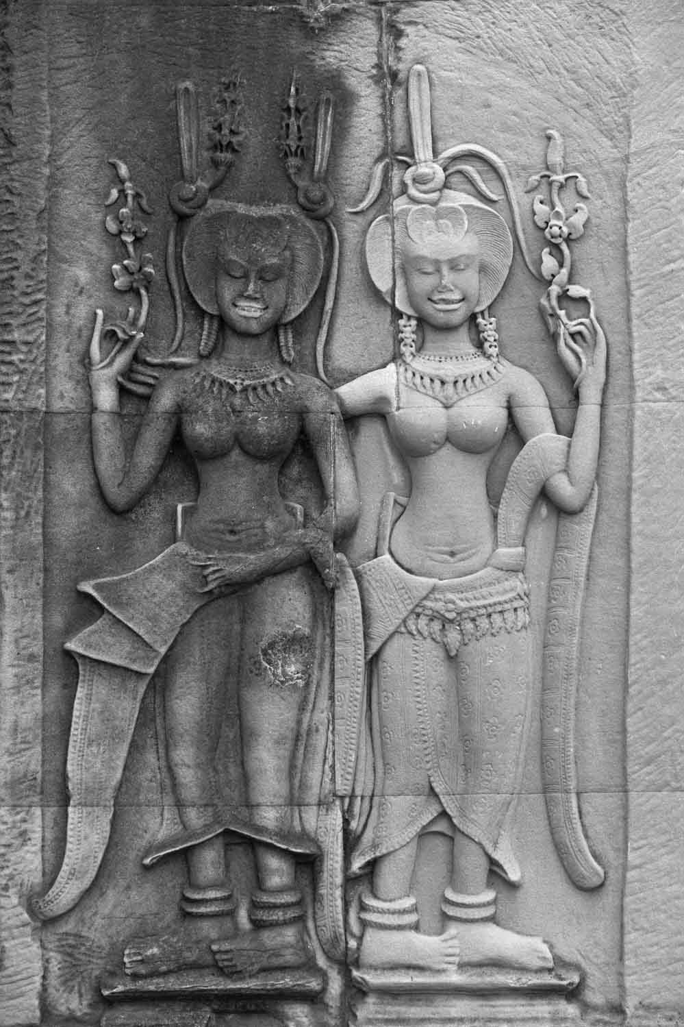 Asparas, beautiful dancing girls from Hindu mythology, on the wall at Angkor Wat