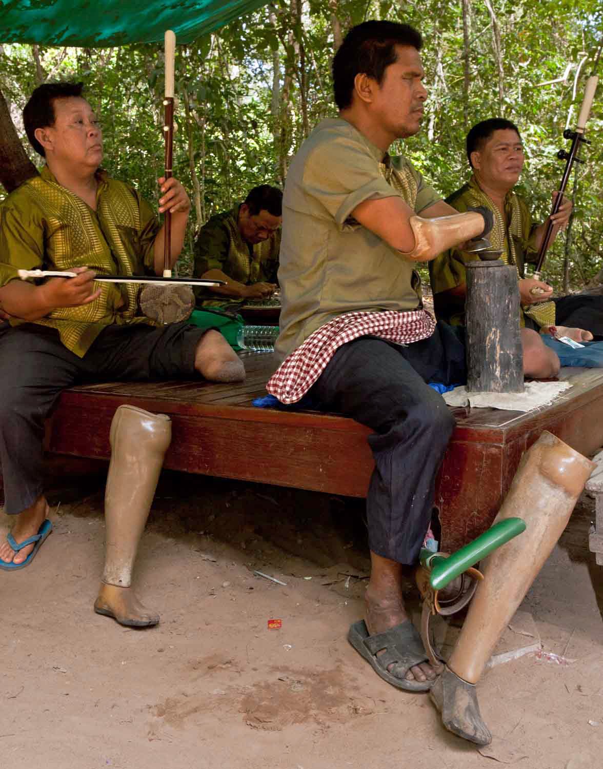 A musical ensemble comprised of mine victims perform at Ta Prohm.