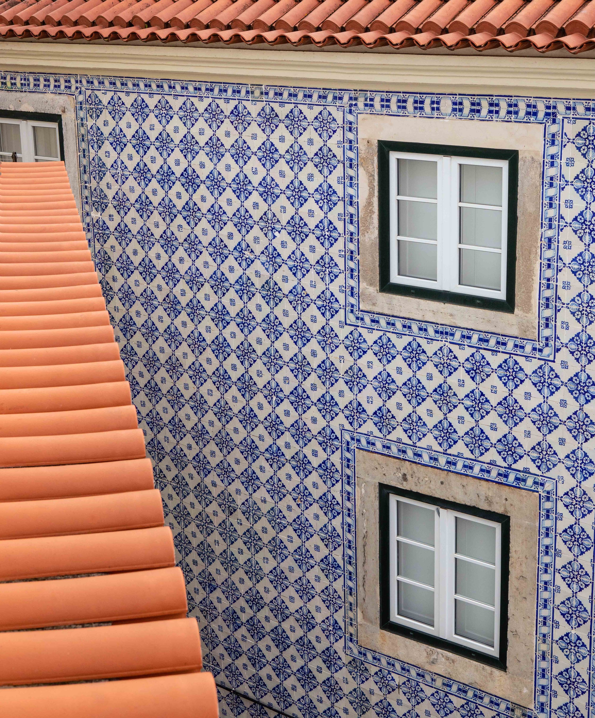 Azulejos wall tiles and terracotta roof tiles . . . Lisbon’s classic exterior look.