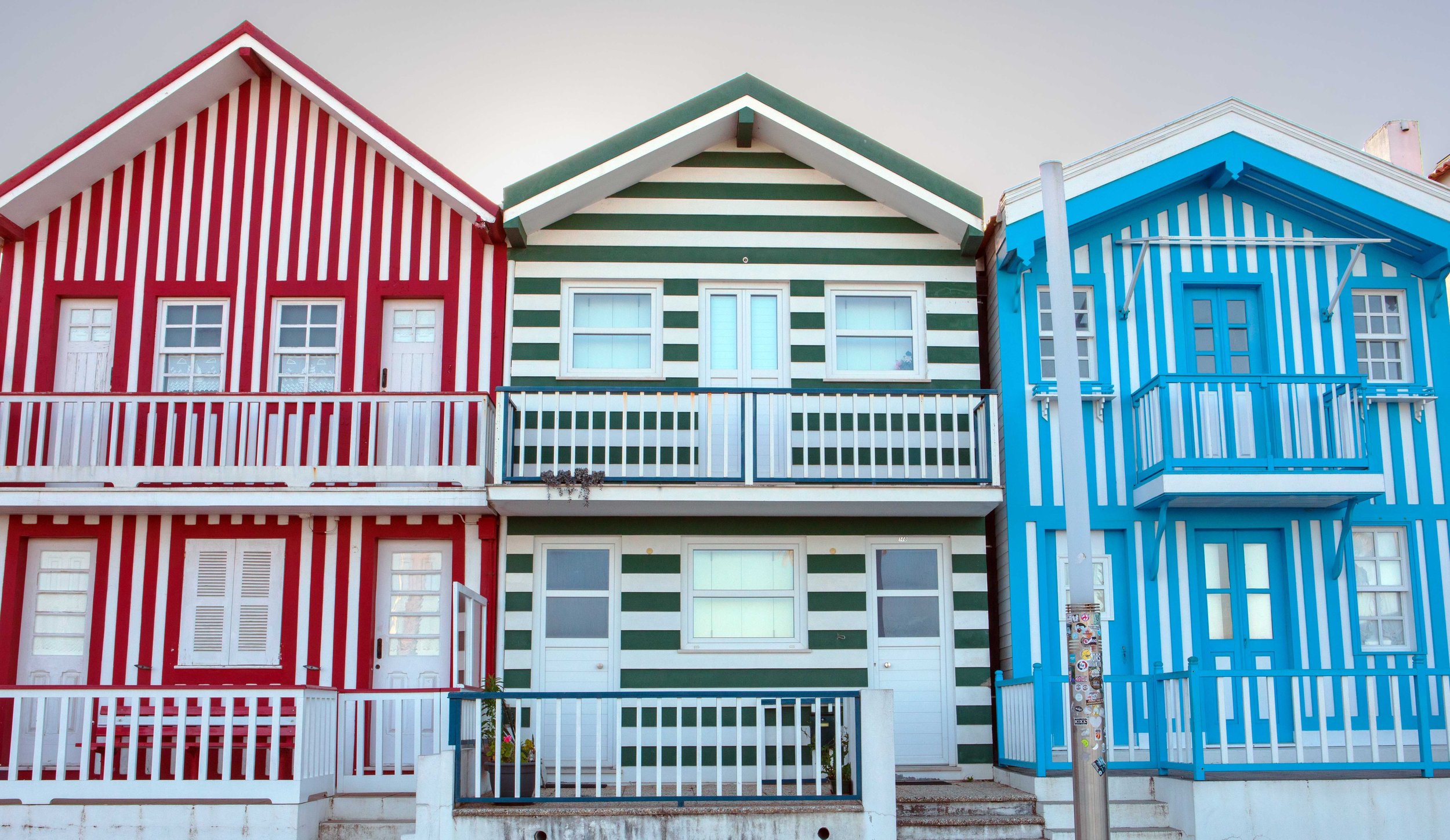 Striped, colorful houses in Costa Nova, on the Atlantic coast and across the Ria de Aveiro lagoon from Aveiro.