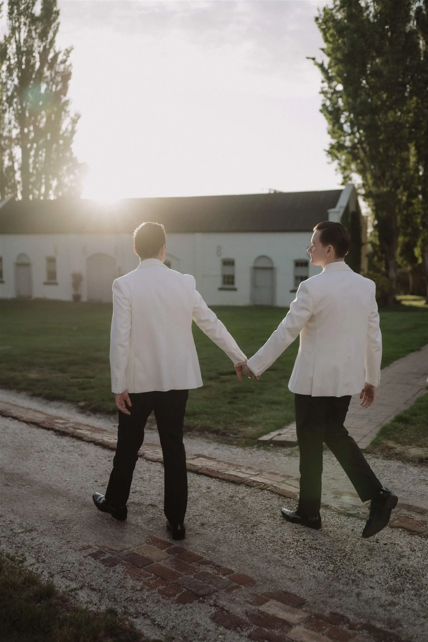 two grooms walking in Vaucluse Estate in Launceston