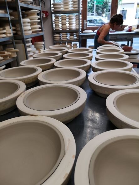 Deep plates are drying on their moulds after gauging