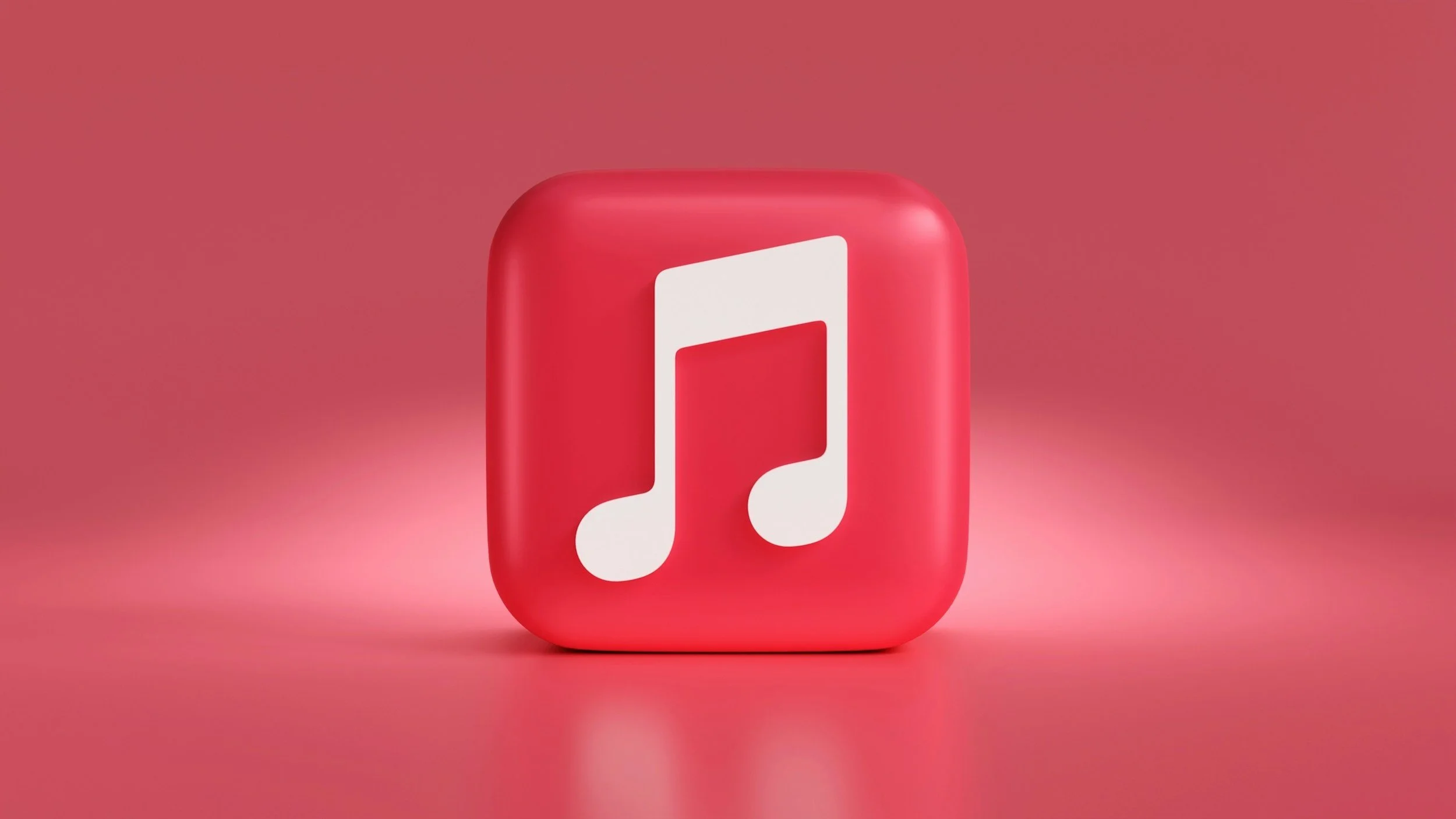 3D rendering of a red square icon with rounded edges and a white musical note symbol in the center, set against a matching pink background.