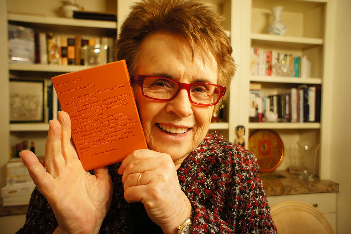 Billie Jean King at home holding The Thing, 2013.