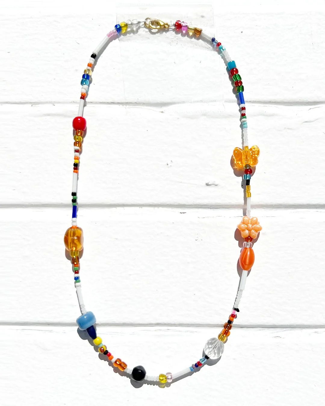 SHORT_ORANGE FLOWER NECKLACE-1.jpg