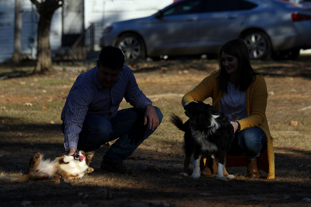 dog-rolling-on-ground-tongue-out-couple-mini-session-documentary-family-photography-north-mississippi.jpg