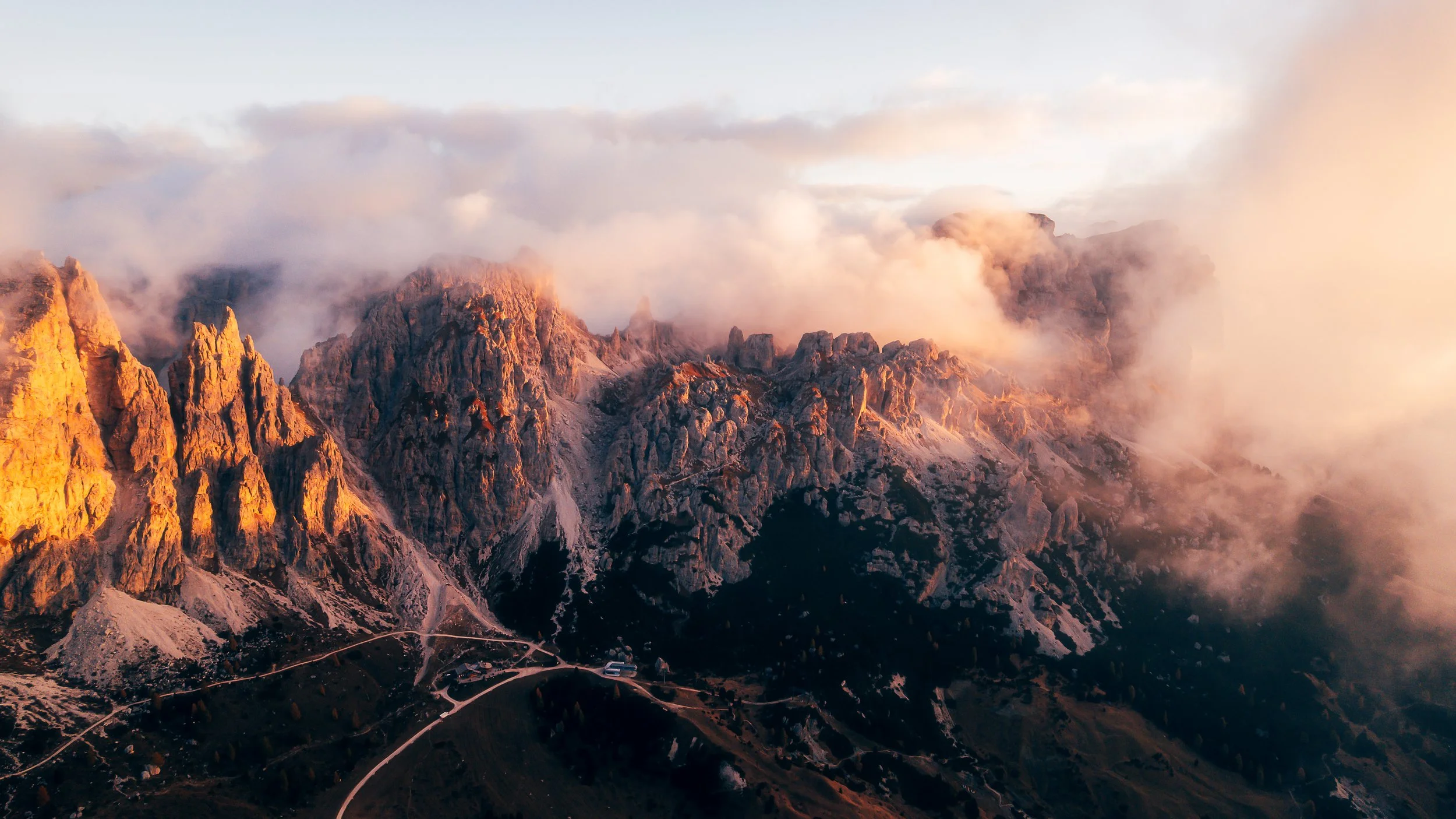 Gardena Pass Drone Sunrise Foggy Peaks.jpg
