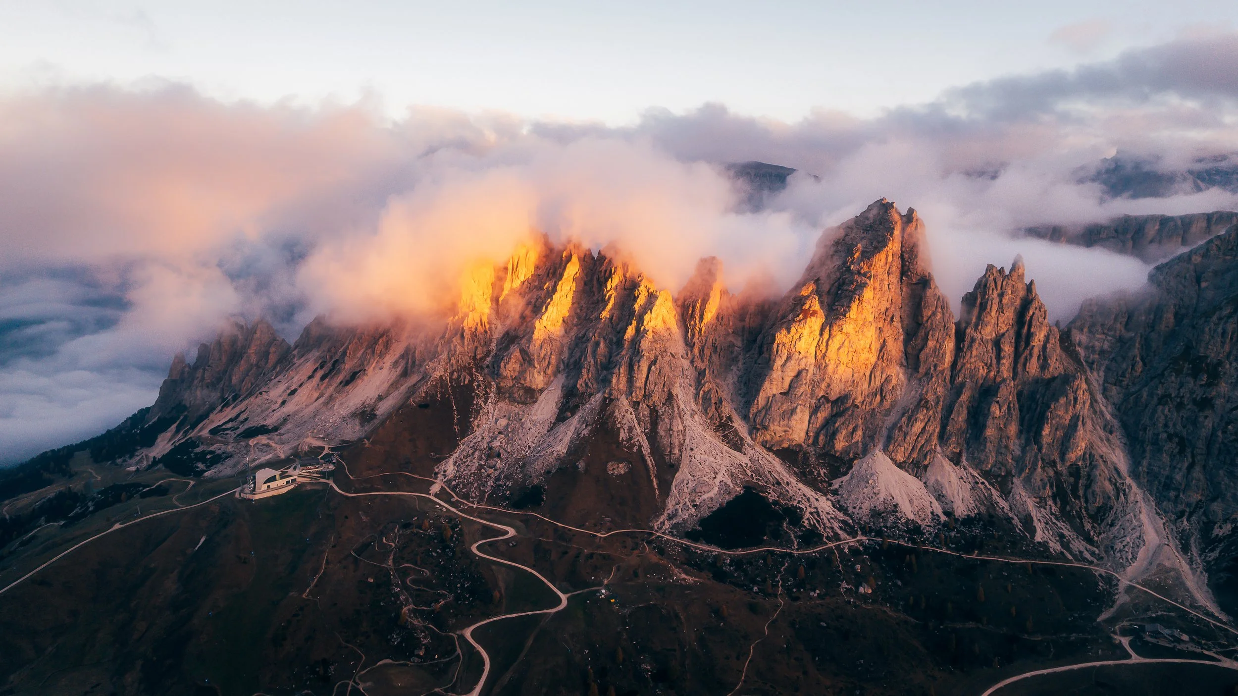 Gardena Pass Drone Sunrise Ridge Peaks.jpg