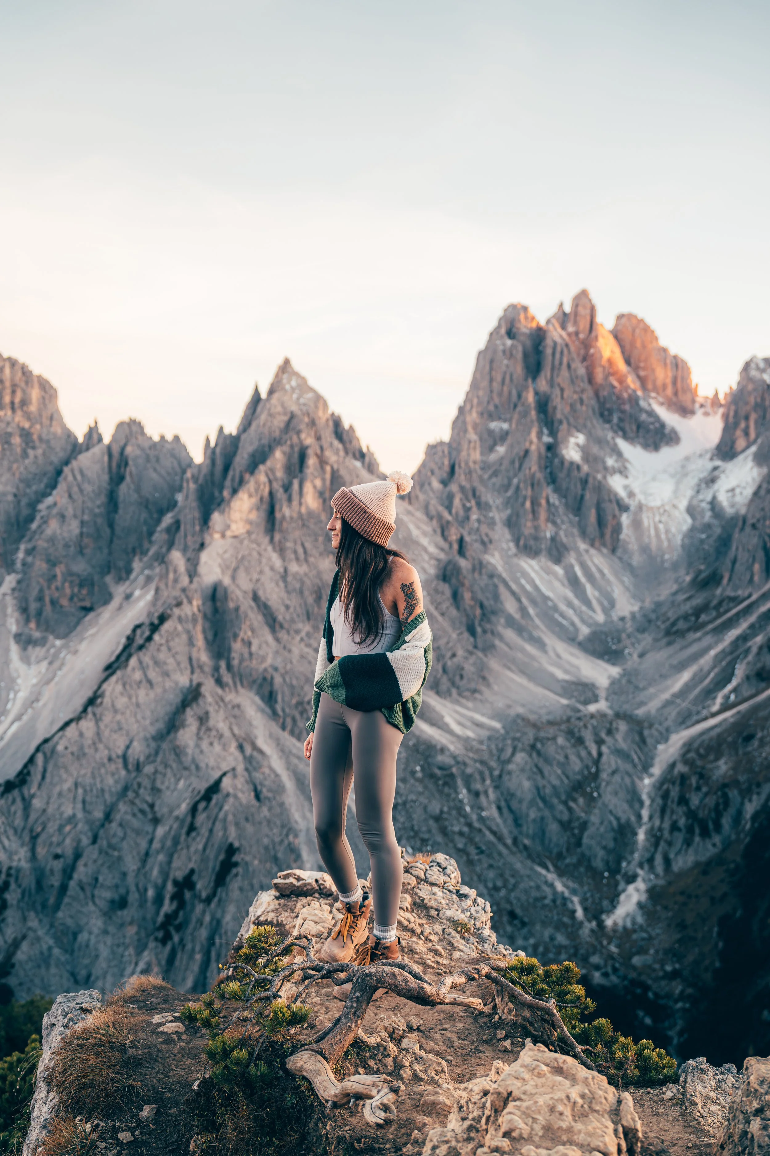 Photographer, Nicole Zelkowitz, stands amongst the Italian Dolomites on the hike Cadini di Misurina..